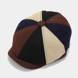 Detailed top view showing color-block patchwork and woven texture of the beret hat