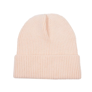 Close-up of soft pink ribbed knit beanie showing high-quality texture and rolled cuff