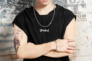 Silver stainless steel snake chain set with necklace and bracelet on a street style model