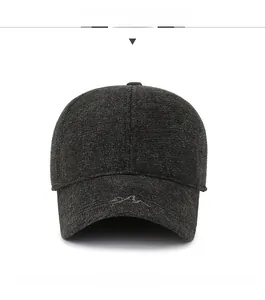 Front view of a dark grey winter baseball cap with thick wool texture and mountain logo