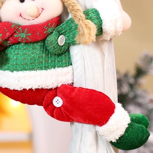 Detailed view of Christmas elf curtain buckle featuring green knit and red velvet textures