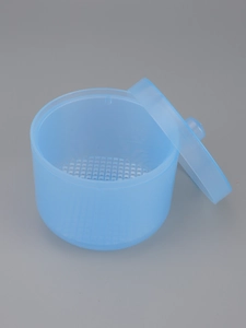 Detailed top view of light blue nail tool disinfectant soaking cup with inner filter