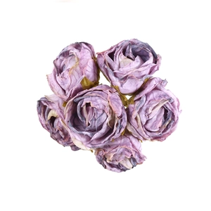 Detailed close-up of vintage purple faux rose heads for DIY crafts and floral arrangements