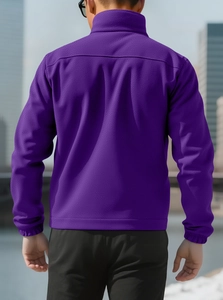 Back view of a men's purple polar fleece jacket with high collar standing in an urban setting
