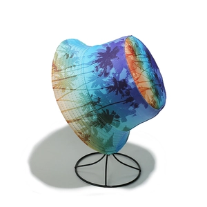 Close-up of a gradient bucket hat featuring black palm tree prints for summer beach