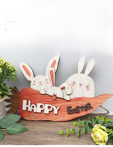 Detailed view of wooden Happy Easter sign with cartoon bunnies and carrot on rustic table