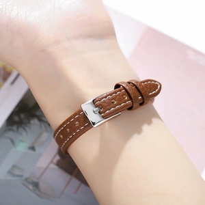 Square luxury wristwatch with brown leather strap and white stitching for women