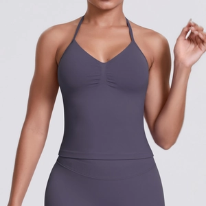 Detail of dark mauve yoga bra with halter neck, V-neckline and gathered bust design