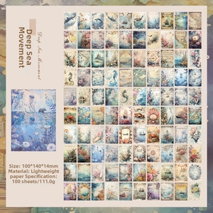 Macro view of 100 sheets vintage ocean themed scrapbook paper with seahorse and whale designs