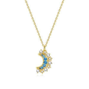 Close-up of golden crescent moon pendant with inlaid blue and white crystals on chain