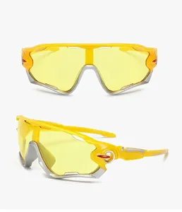 Detail of yellow cycling glasses with night vision polarized lenses and silver trim