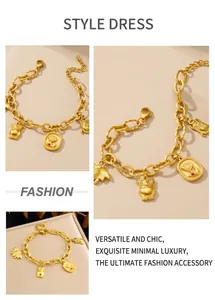 Detailed macro view of 18K gold-plated owl, rose, beetle, and bee charms on a chain