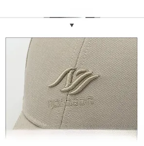 Close-up of premium beige baseball cap showing detailed 3D embroidery and breathable knit texture