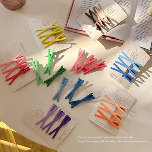 Set of macaron-colored X-shaped matte hair clips for girls, shown in three-piece packs