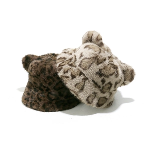 Close-up of leopard print faux fur bucket hats with cute bear ears in brown and gray