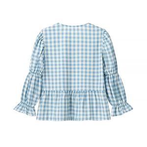 Detail view showing the back of blue plaid blouse with ruffle hem and puff sleeves