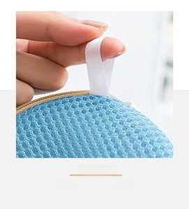 Detail showing the blue mesh laundry bag with a hanging loop for easy drying