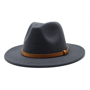 Detail of dark grey wool fedora hat featuring a brown snakeskin pattern leather band