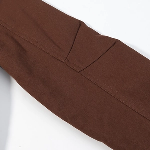 Macro view of brown fabric texture with reinforced stitching on the hooded parka