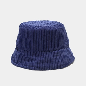 Close-up of navy blue corduroy fabric texture on a retro bucket hat for women
