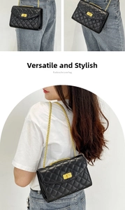 Detail of black quilted leather crossbody bag with gold metal chain and turn-lock