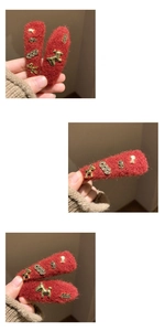 Detail of red wool felt hair clips with lucky gold charms and vintage metal horse accents