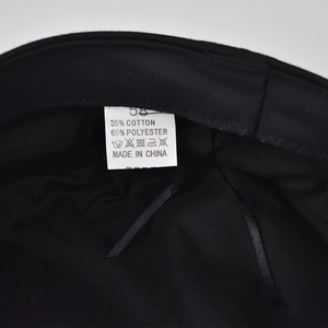 Detail of the cotton blend inner lining and size label for the silver chain beret hat