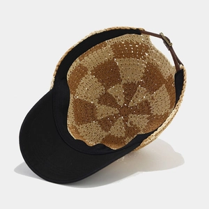 Straw checkered baseball cap with black brim and leather strap for sun protection