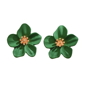 Detail of green floral earrings with golden center in a modern Chinese style