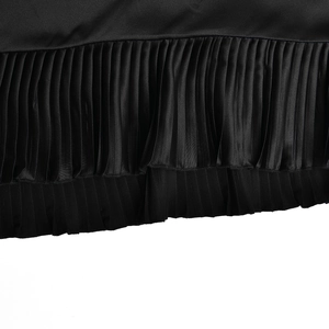 Macro view of the pleated hem detail on this black fashion bodycon fishtail skirt