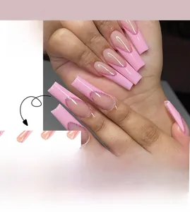 Macro view of long square French press-on nails with nude base and pink glitter tips