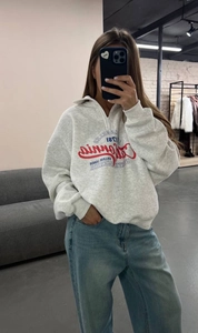 Detail of grey quarter-zip fleece sweatshirt with vintage Los Angeles graphic print