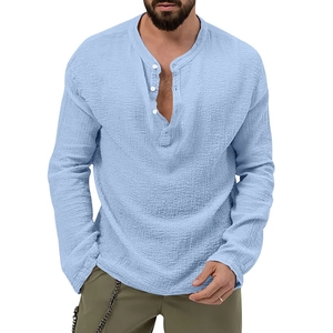 Close-up of light blue linen-textured long-sleeved Henley shirt with button details