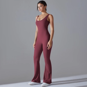 Detailed side view of slim fit burgundy yoga jumpsuit with wide straps and flared pants