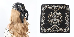 Detail of black satin square scarf with white floral print shown as headwrap and flat lay