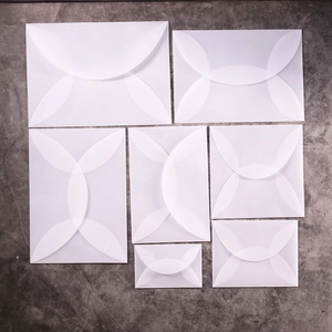 Translucent vellum envelopes in various sizes with petal-style curved fold closures