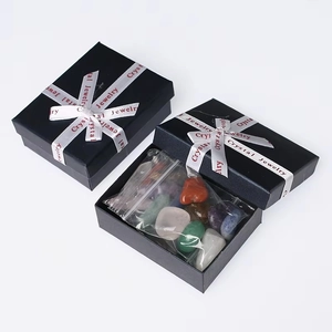 Black jewelry gift box set with multi-colored tumbled natural gemstones and white ribbon