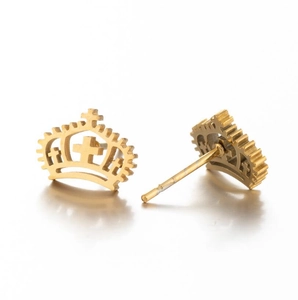 Detail shot of golden crown and cross stud earrings made of polished stainless steel
