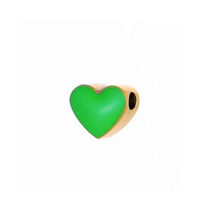 Detail of a bright green heart-shaped enamel charm with golden metal edges for DIY jewelry