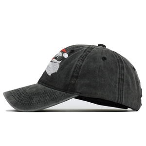 Close-up of Santa Claus embroidery on washed cotton vintage black baseball cap