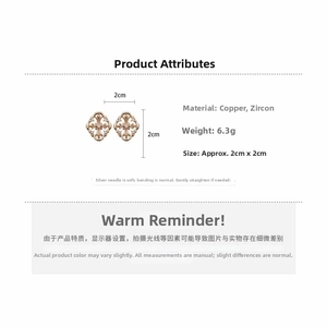 Detail showing weight and size of vintage hollow cross earrings with zircon inlays