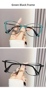Detail of trendy cat-eye metal glasses frames in green black and solid black finish