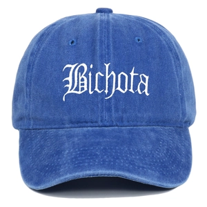 Detailed view of Bichota white gothic embroidery on blue washed cotton baseball cap
