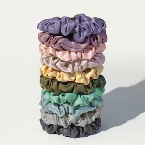 Set of 10 satin silk scrunchies in pastel colors including purple and mint green