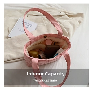 Pink quilted tote bag detail showing large inner capacity and secure magnetic snap button