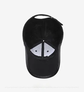 Detail view of the black baseball cap interior lining with stitching and air vents