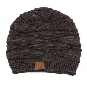 Detail of dark brown knit beanie featuring thick cross-weave texture and F&S leather patch