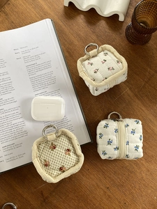 Quilted floral fabric pouch organizer with metal clip and checkered lining for headphones