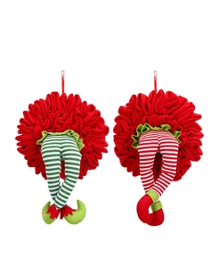 Detail of Christmas elf legs with red and green striped socks for holiday tree decoration