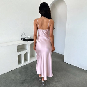 Detailed back view of pink satin maxi dress with backless design and silky sheen